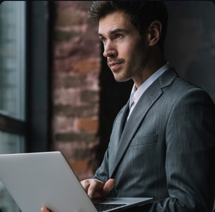 Consultant reviewing strategy on a laptop